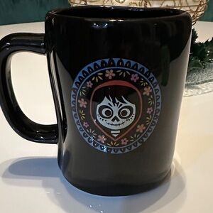 Rae Dunn Disney and Pixar CoCo Black 16 ounce mug- 2 side design  - like new!